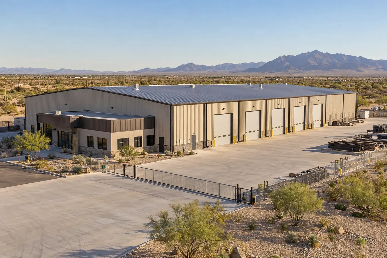 Industrial metal manufacturing building and fenced materials yard concept
